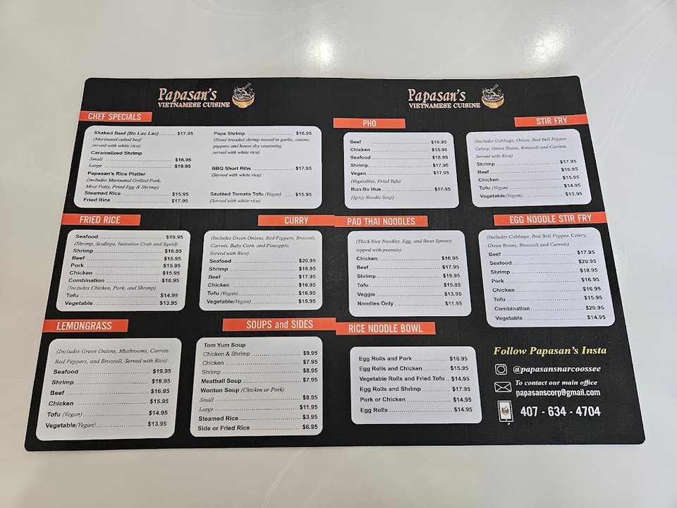 Printed menu with appetizers, rolls, and banh mi.
